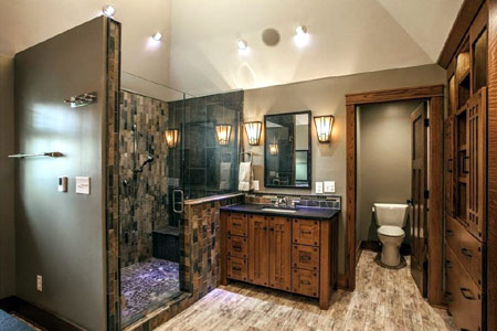 Remodeled bathroom with a tiled walk-in shower and custom vanity