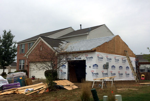 Attached garage addition matched to the existing house siding and roof